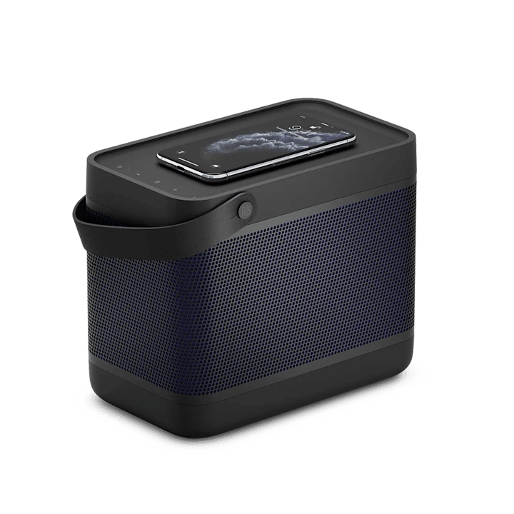 Beolit 20 portable Bluetooth speaker with smartphone charging wirelessly on top