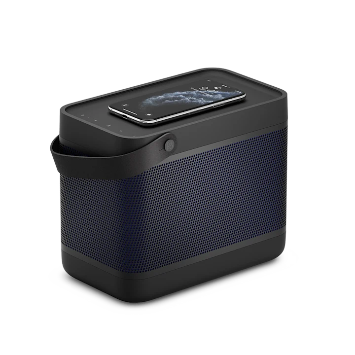 Beolit 20 portable Bluetooth speaker with smartphone charging wirelessly on top