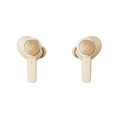 Beoplay EX trådløse earbuds i guld farve på hvid baggrund