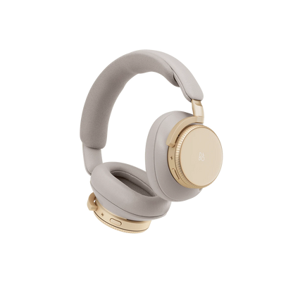 Beoplay H100 over-ear hovedtelefoner i lys grå med guld detaljer på hvid baggrund